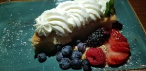 Tres Leches cake dessert with fresh berries