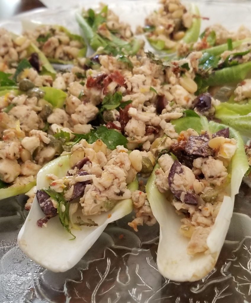 Mediterranean chicken salad on endive lettuce beds