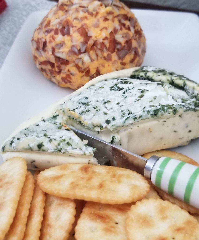 Dill-encrusted Brie and nutty cheddar cheese