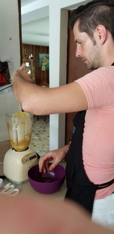Brandon pulverizes the mangoes in the blender