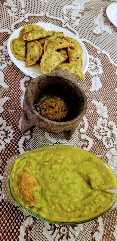 empanadas, hot sauce and guacamole