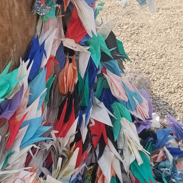 A multitude of origami cranes at the cemetery